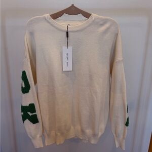 Elegant Cream Sweater with Green Lettering